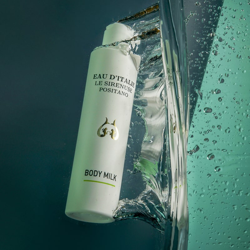Lifestyle shot of Eau d'Italie Body Milk (200 ml) with body milk submerged in water