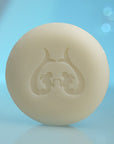 Eau d'Italie Scented Soap round soap shown unwrapped with the Eau d'Italie logo