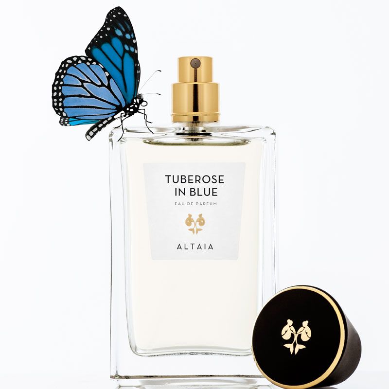 Beauty shot of ALTAIA Tuberose in Blue Eau de Parfum - 100 ml with cap off and blue butterfly on bottle 