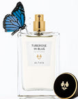 Beauty shot of ALTAIA Tuberose in Blue Eau de Parfum - 100 ml with cap off and blue butterfly on bottle 