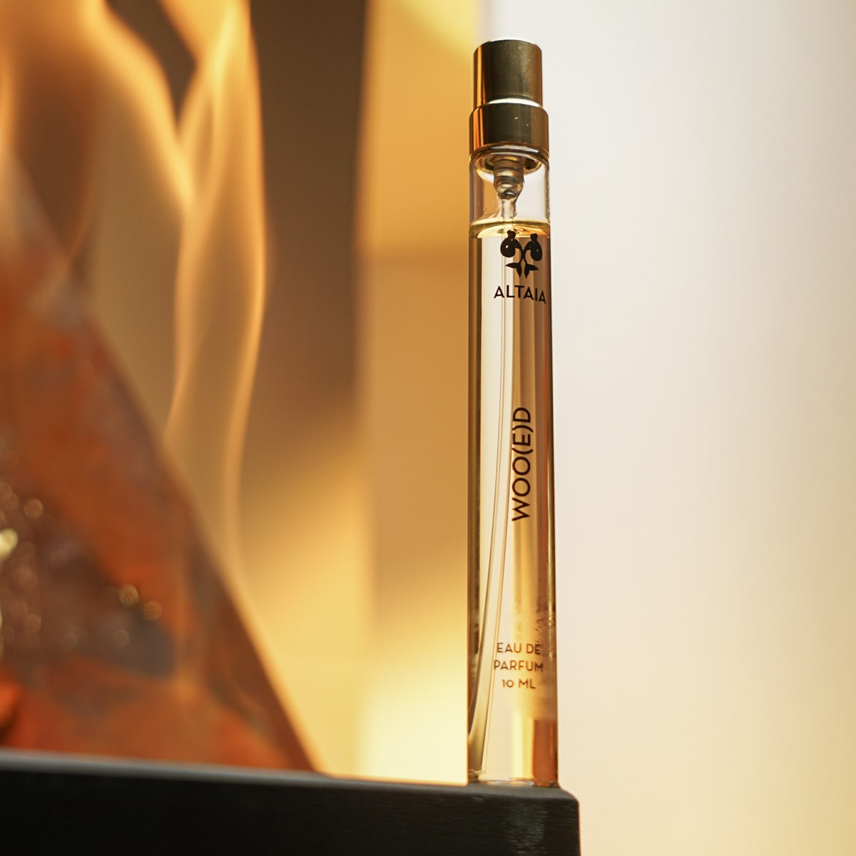 ALTAIA Woo(e)d Eau de Parfum (10 ml) - product shown near flames