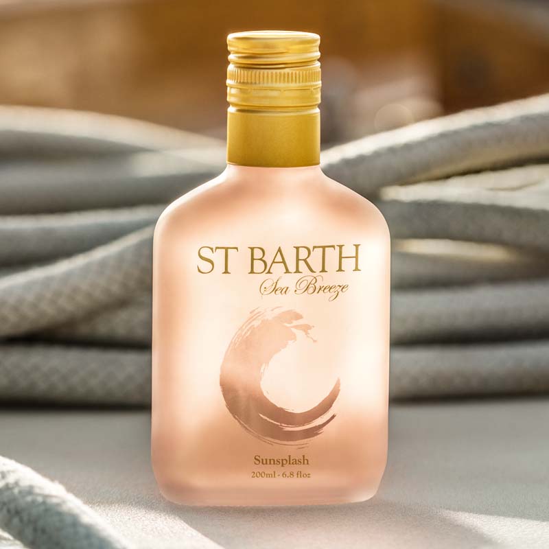 Beauty shot of Ligne St. Barth Sea Breeze Sunsplash Face & Body Splash 200 ml with ropes in the background