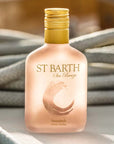 Beauty shot of Ligne St. Barth Sea Breeze Sunsplash Face & Body Splash 200 ml with ropes in the background