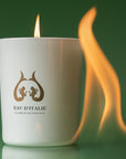 Eau d'Italie Scented Candle (190 g) shown burning with large flame shown next to candle