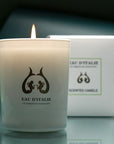 Lifestyle shot of Eau d'Italie Scented Candle (190 g) shown burning with box in the background