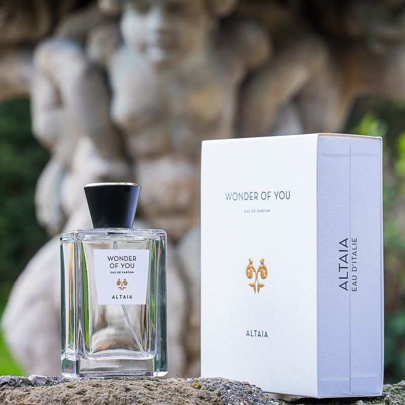 Lifestyle shot of ALTAIA Wonder of You Eau de Parfum (100 ml) and box closed with statue in the background