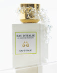 Lifestyle shot zoomed in of Eau d'Italie Eau de Parfum Spray (100 ml) with water splashing