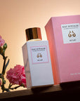 Lifestyle shot of Eau d'Italie Au Lac Eau de Parfum Spray (100 ml) with box and pink carnations in the background