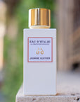 Lifestyle shot of Eau d'Italie Jasmine Leather Eau de Parfum Spray (100 ml) on stone ledge