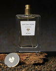 ALTAIA Any Day Now Eau de Parfum - Product shown on top of log, with cap off