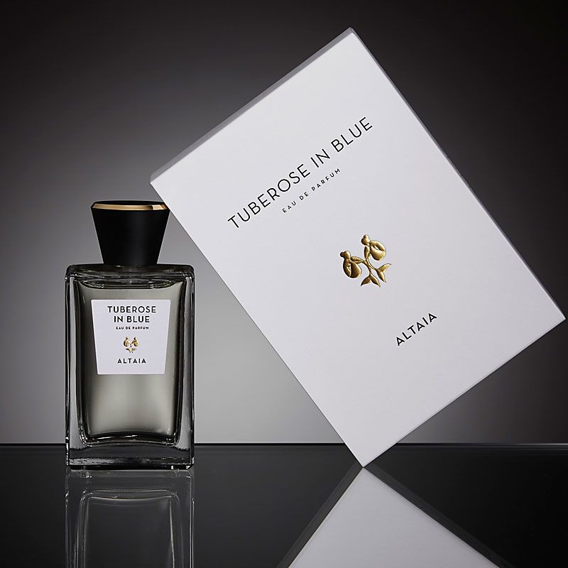 Beauty shot of ALTAIA Tuberose in Blue Eau de Parfum - 100 ml with box and black background