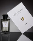 Beauty shot of ALTAIA Tuberose in Blue Eau de Parfum - 100 ml with box and black background